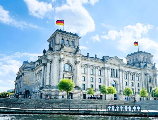 The Reichstag Building with White Cross Memorial in front.