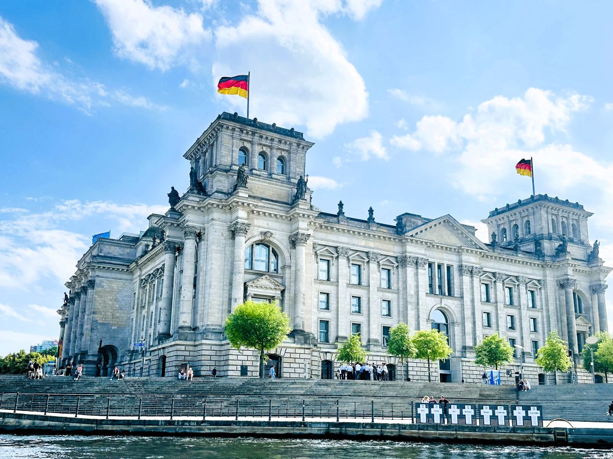 The Reichstag Building with White Cross Memorial in front.