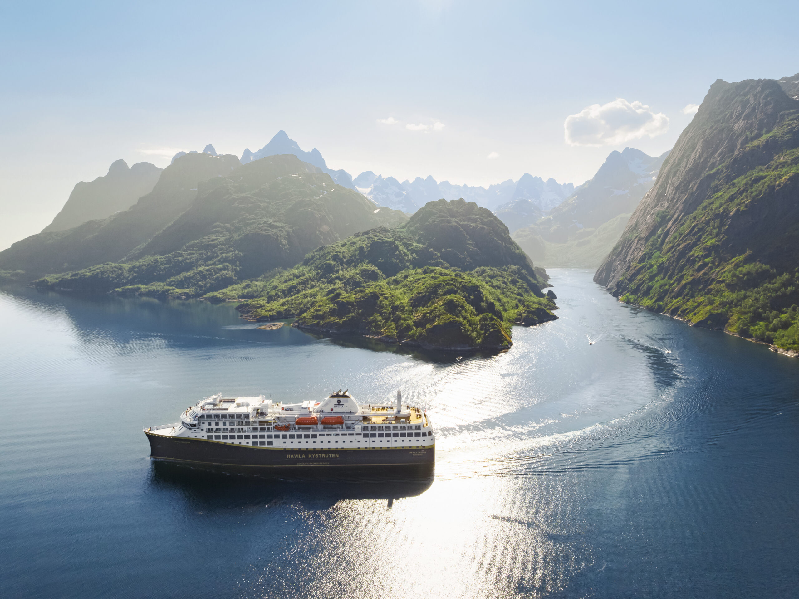 A Havila Voyages cruise ship sailing in Trolljorden along the Norwegian Coast.