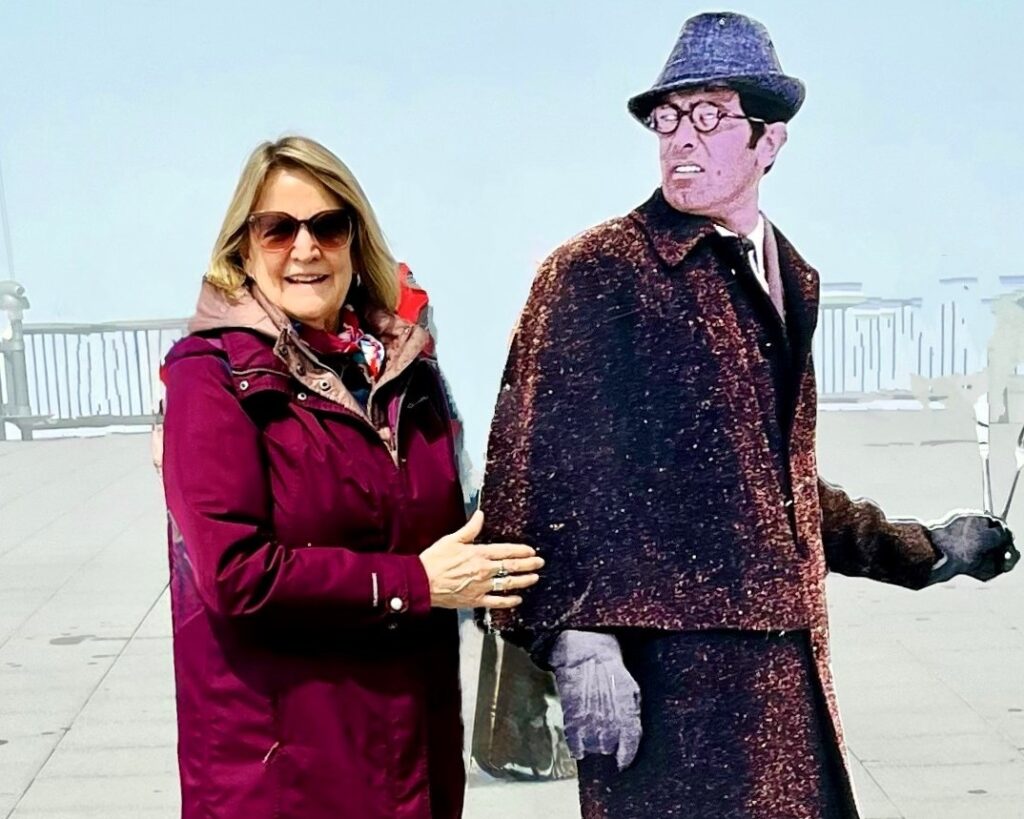 Author with a cutout of George Lazerbee, who starred as James Bond in movie shot at Schilthorn. Photo credit Ron Jordan