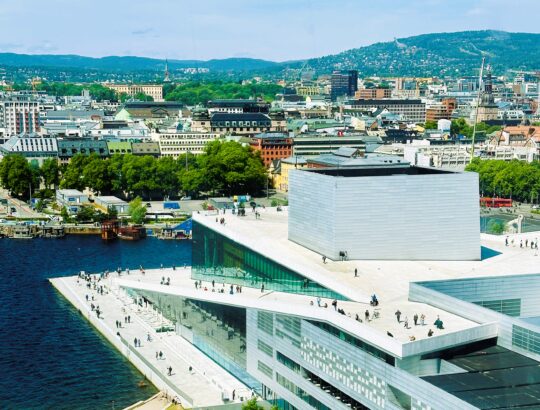 Pedestrian walking the roof of Oslo's National Opera house.